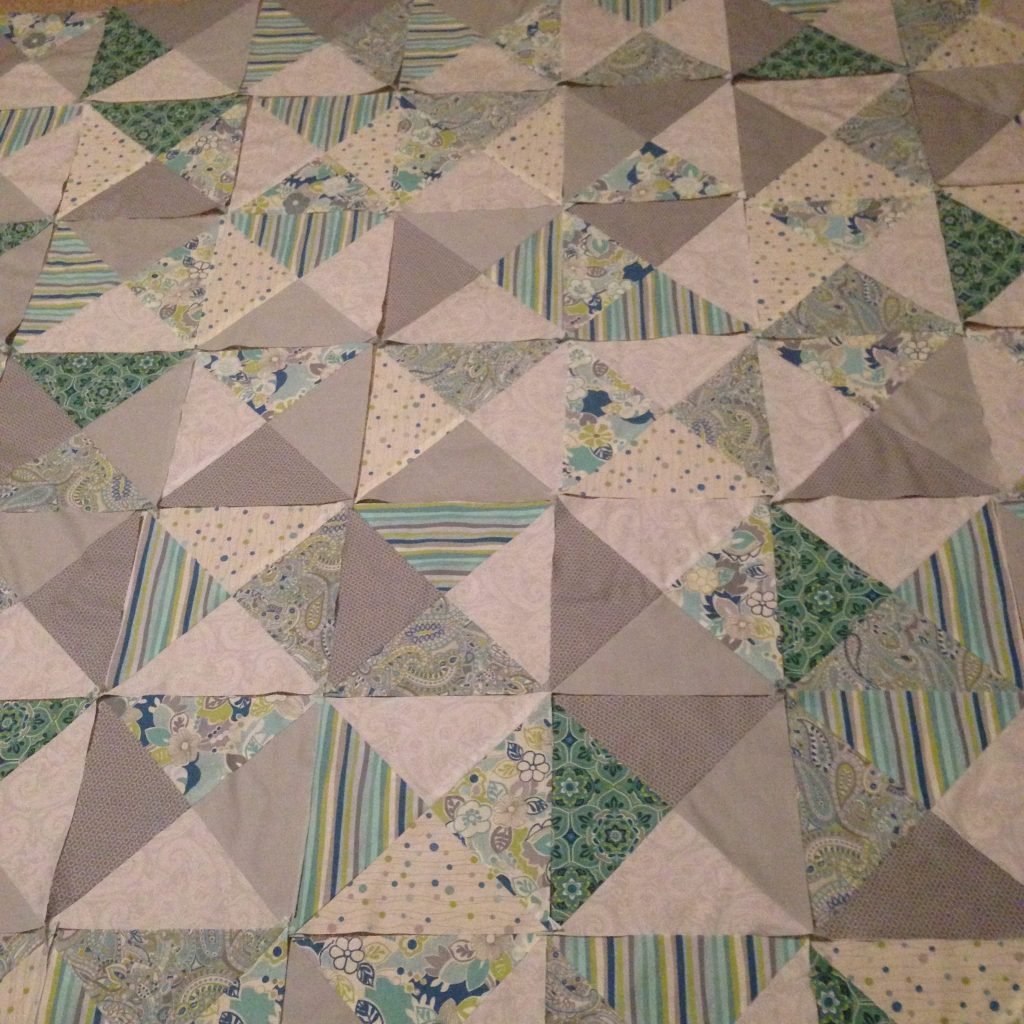 Lots of half square triangles. Blocks are arranged and ready to sew together.  - making progress here at Stacey Sansom Designs