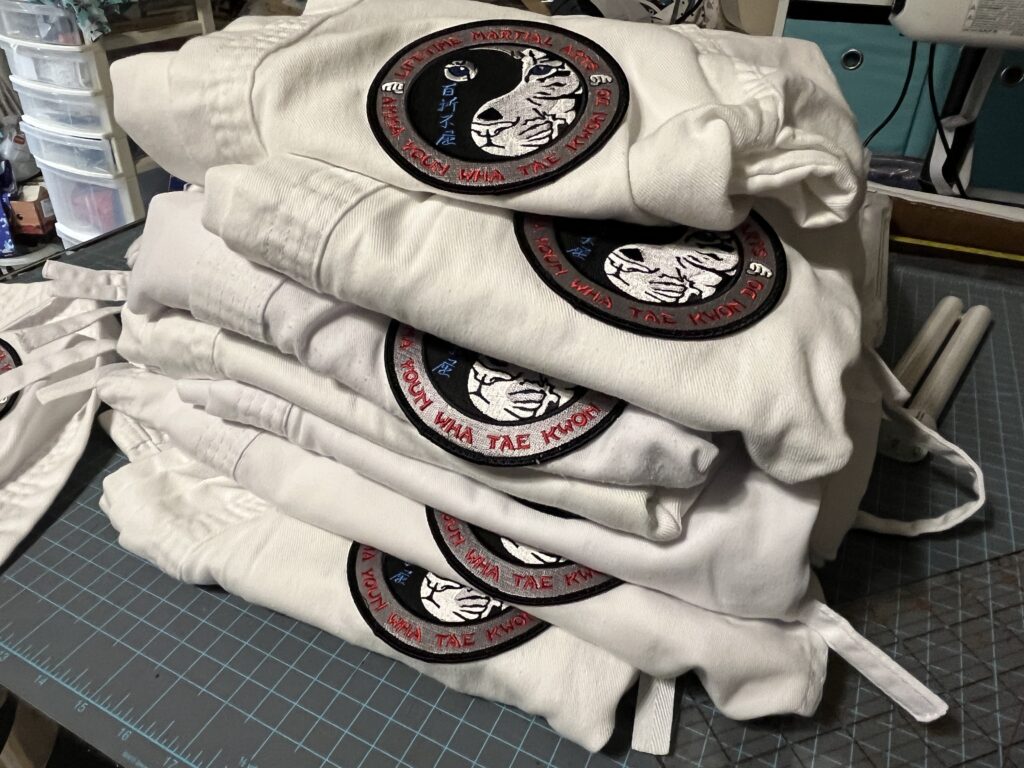 Another batch of patches sewn on for the local karate school. | Patch Sewing Services | Stacey Sansom Designs