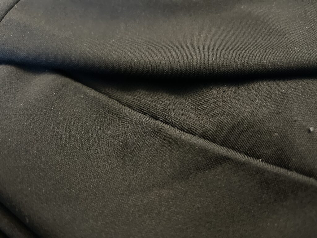 This hem was done on a blind hemmer machine and was falling on more than half of the skirt. The stitching line is sloppy and poorly executed. | No Cut Alterations | No Cut Hems | Services Provided | Stacey Sansom Designs