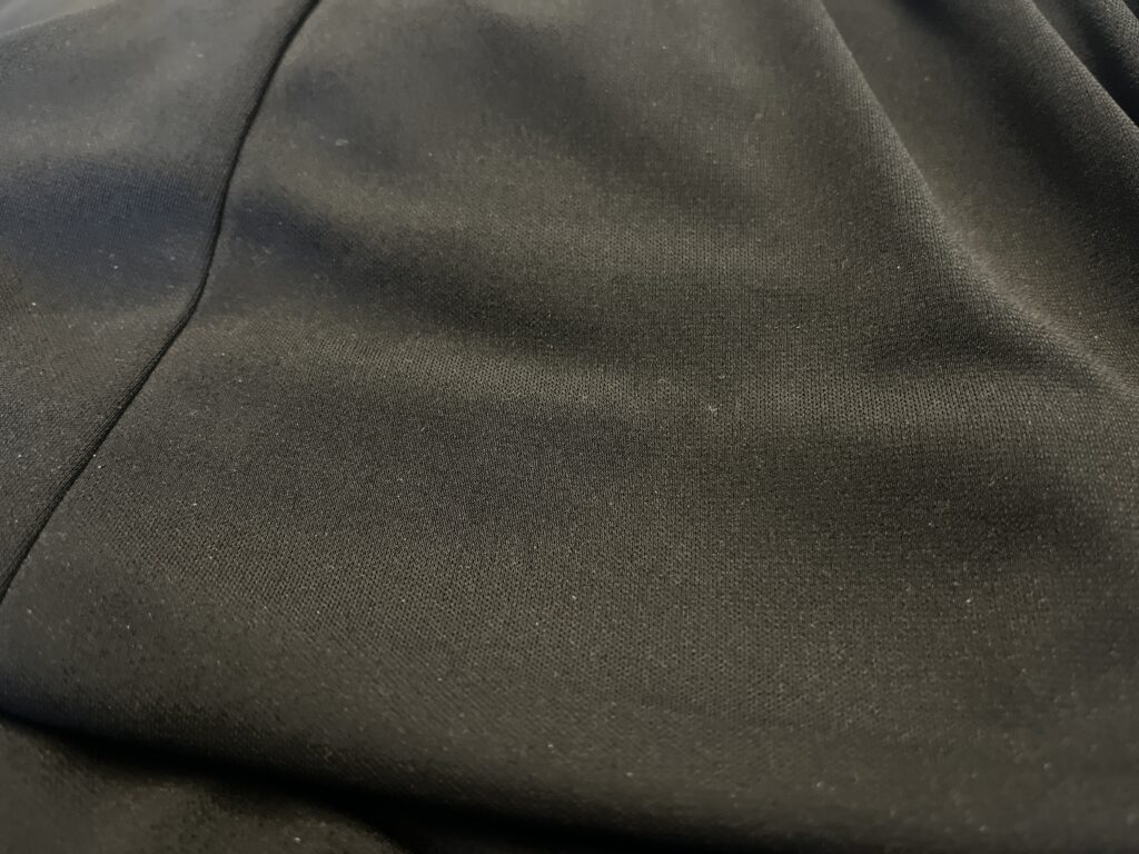 This hem was done on a blind hemmer machine and was falling on more than half of the skirt. The stitching line is sloppy and poorly executed. | No Cut Alterations | No Cut Hems | Services Provided | Stacey Sansom Designs